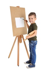 Photo of Child painting picture on easel against white background. Space for text