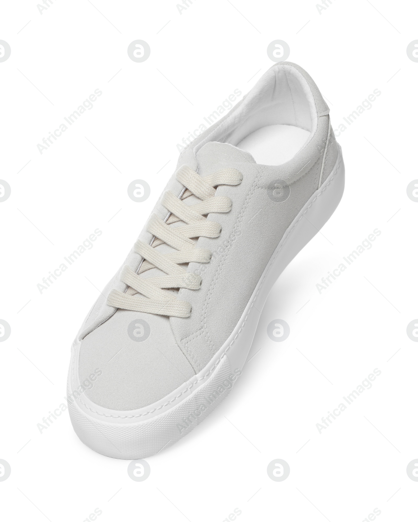 Photo of One stylish beige sneaker isolated on white