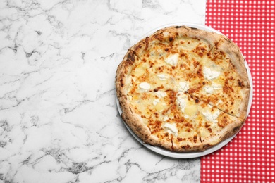 Tasty cheese pizza on white marble table, top view. Space for text