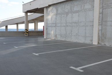 Photo of Empty outdoor car parking lot on sunny day