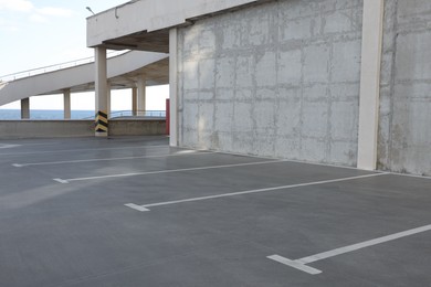 Empty outdoor car parking lot on sunny day