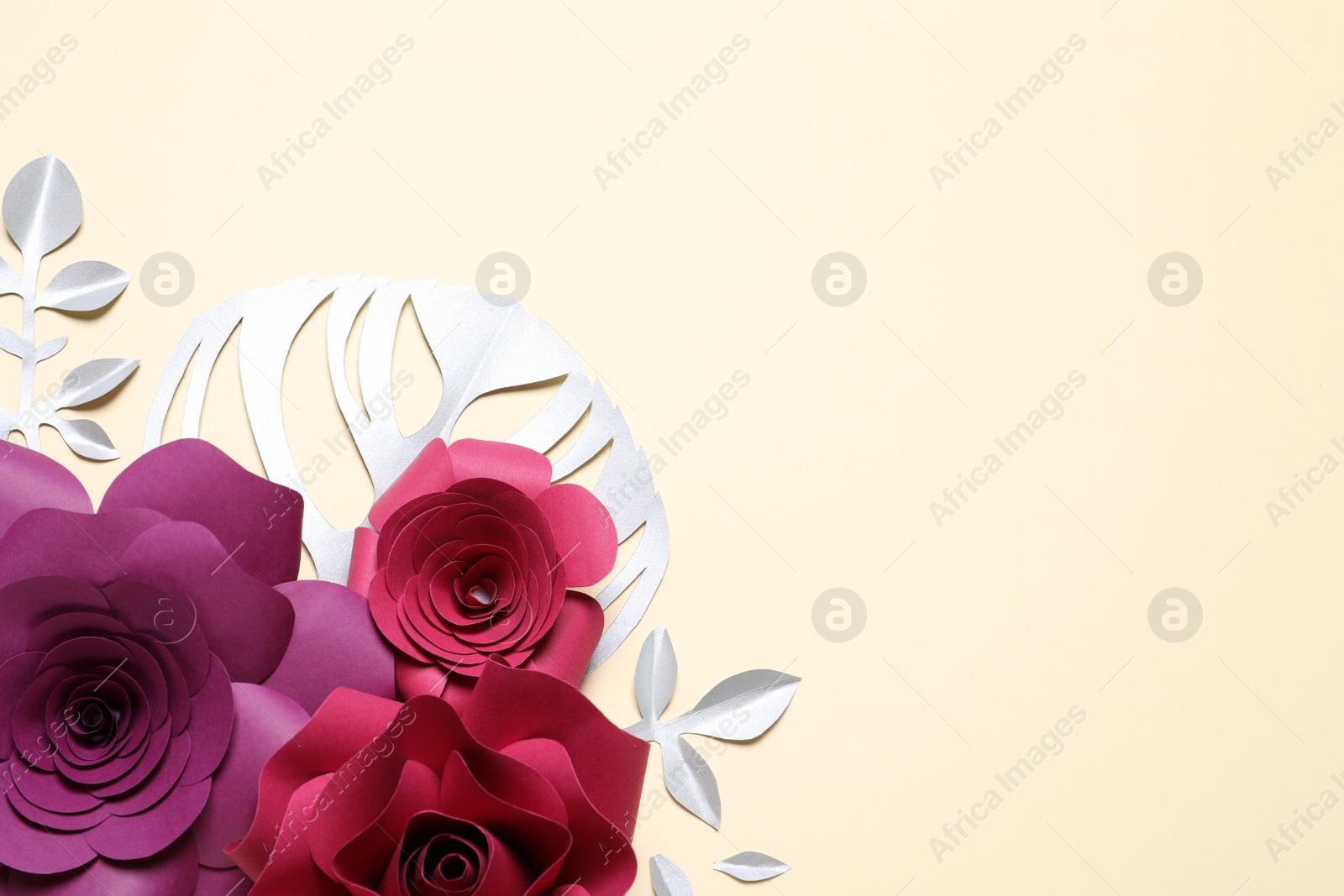 Photo of Different beautiful flowers and branches made of paper on beige background, flat lay. Space for text