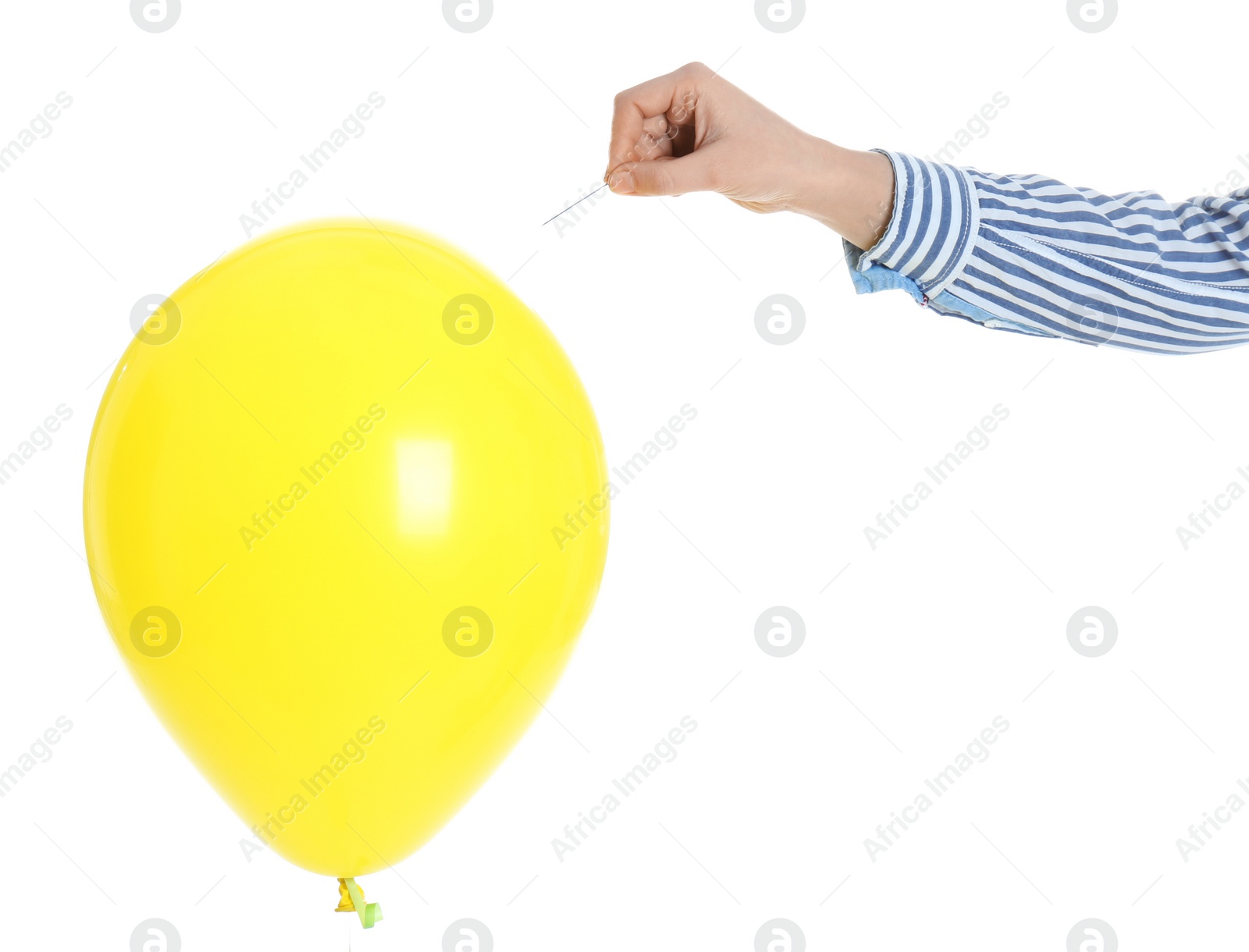 Photo of Woman piercing yellow balloon on white background, closeup