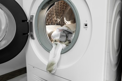 Many dirty socks in washing machine, closeup