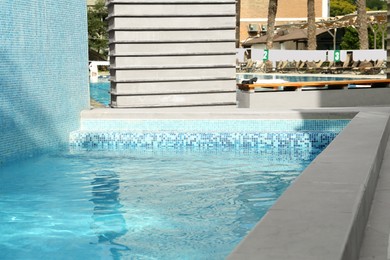 Photo of Outdoor swimming pool with stairs and clear water