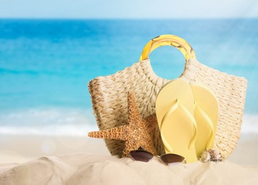 Image of Different beach objects on sandy beach near sea