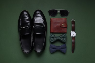 Photo of Flat lay composition with stylish bow ties and shoes on green background