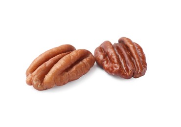 Photo of Two tasty pecan nuts isolated on white