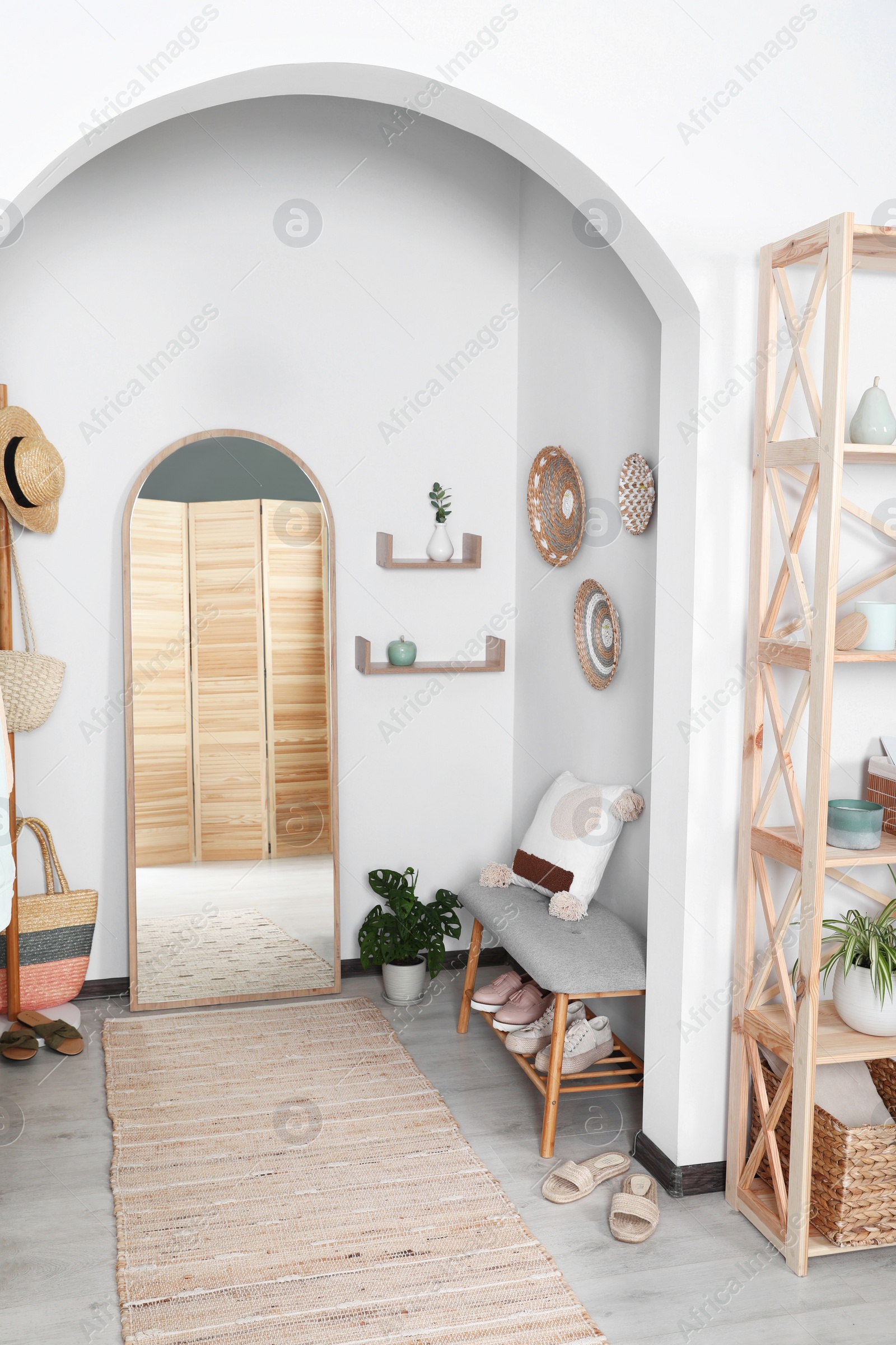 Photo of Hallway interior with stylish furniture and floor mirror