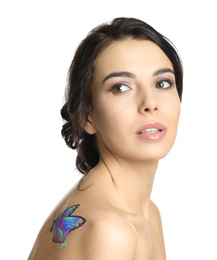 Image of Young woman with colorful tattoo of butterfly on her body against white background