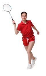 Young woman playing badminton with racket on white background