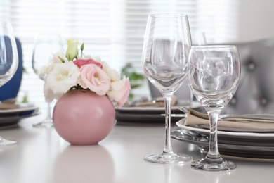 Beautiful table setting in modern dining room interior