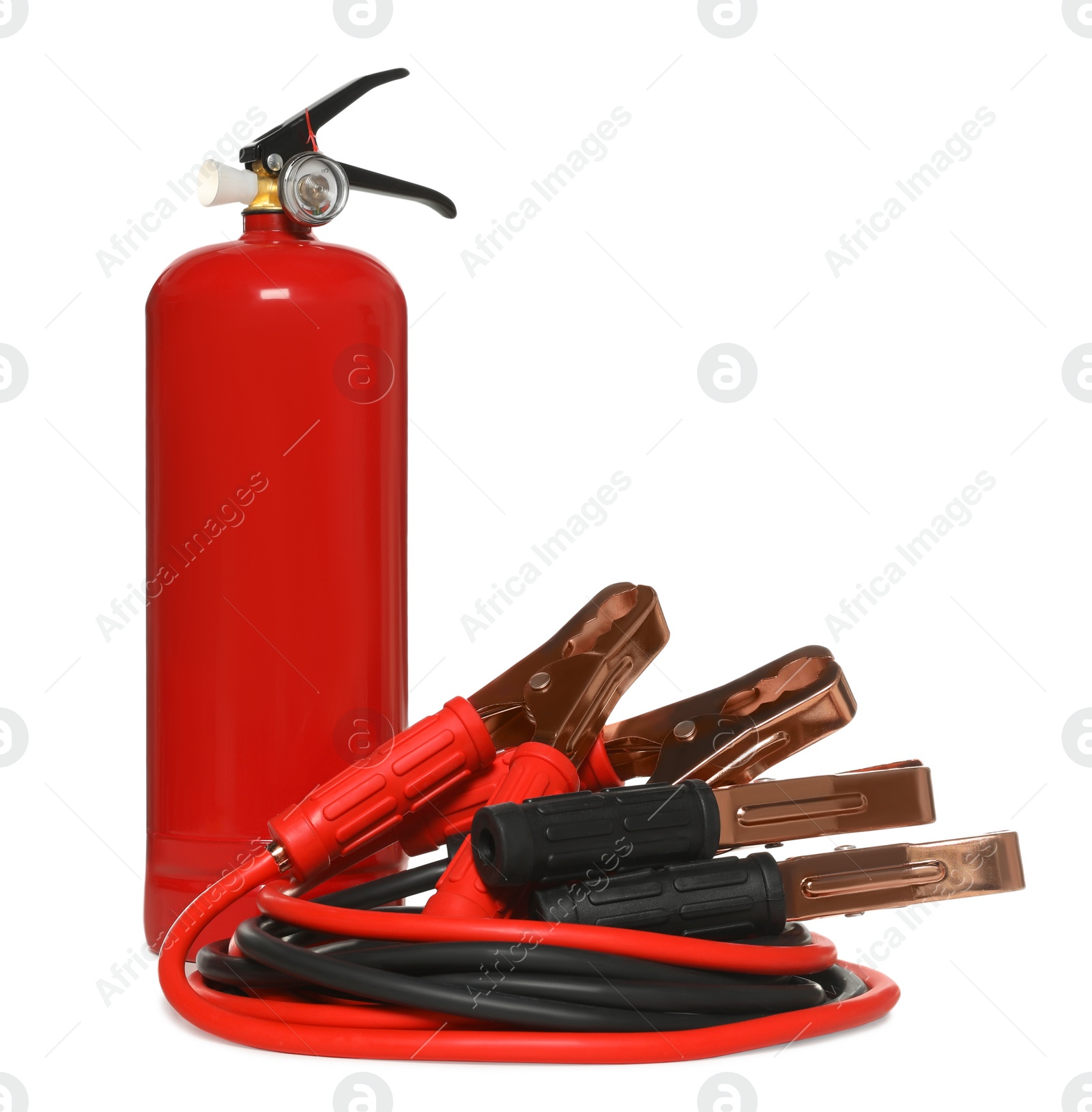 Photo of Red fire extinguisher and battery jumper cables on white background. Car safety