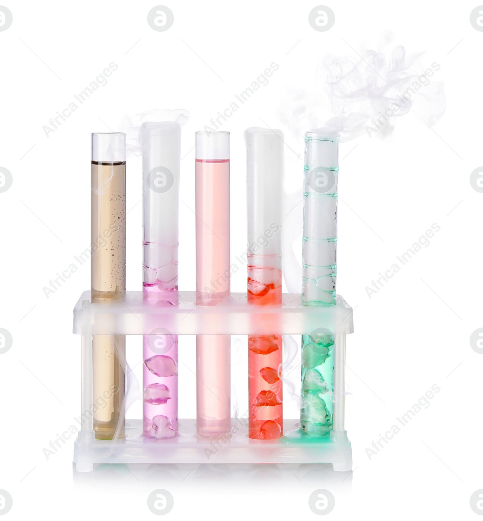 Photo of Test tubes with colorful liquids and steam isolated on white. Chemical reaction