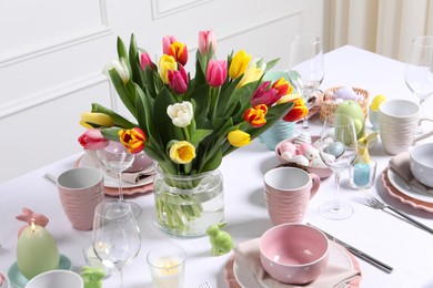 Photo of Festive table setting with beautiful flowers. Easter celebration