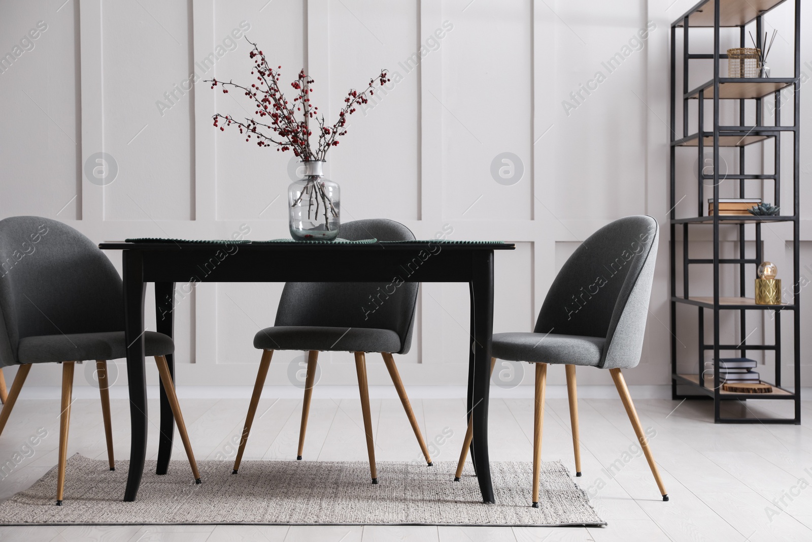 Photo of Beautiful dining room interior with new stylish furniture