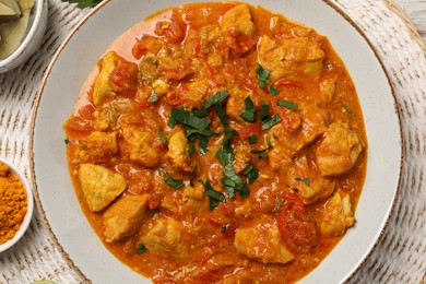 Delicious chicken curry on table, top view