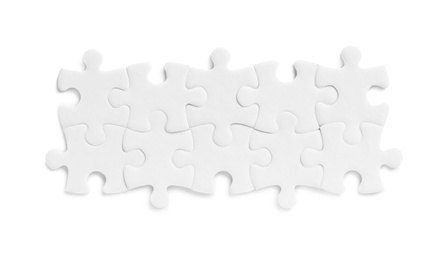 Photo of Blank puzzle pieces isolated on white, top view