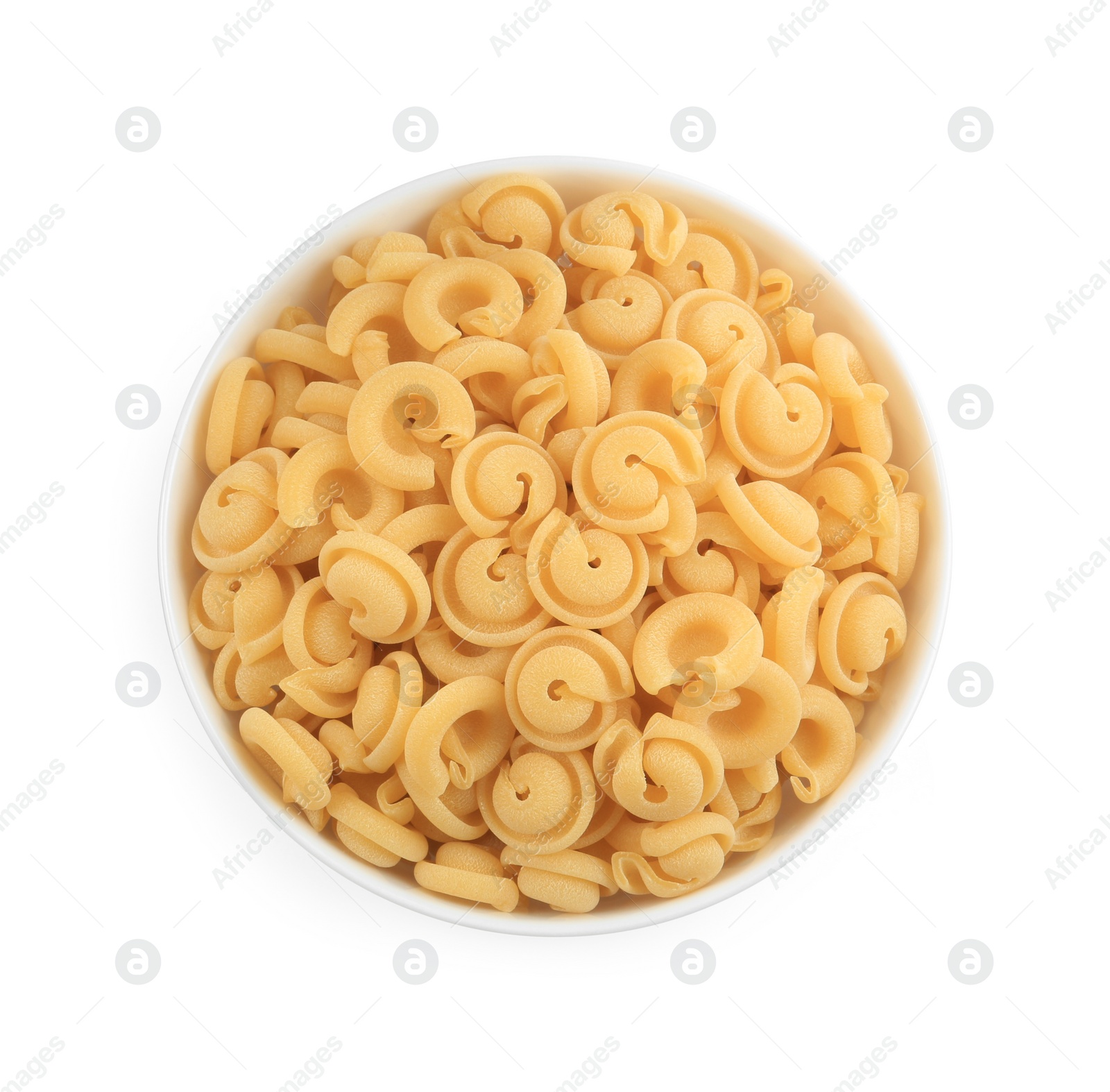 Photo of Raw dischi volanti pasta in bowl isolated on white, top view