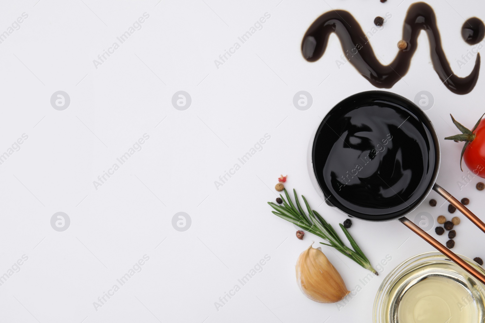 Photo of Organic balsamic vinegar and cooking ingredients on white background, flat lay. Space for text