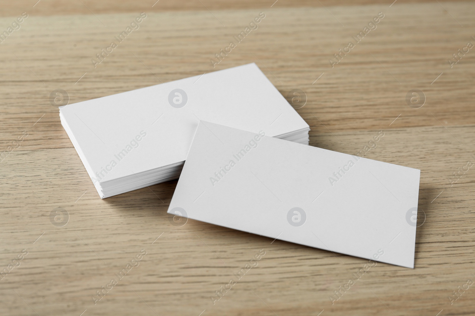 Photo of Blank business cards on wooden background. Mockup for design