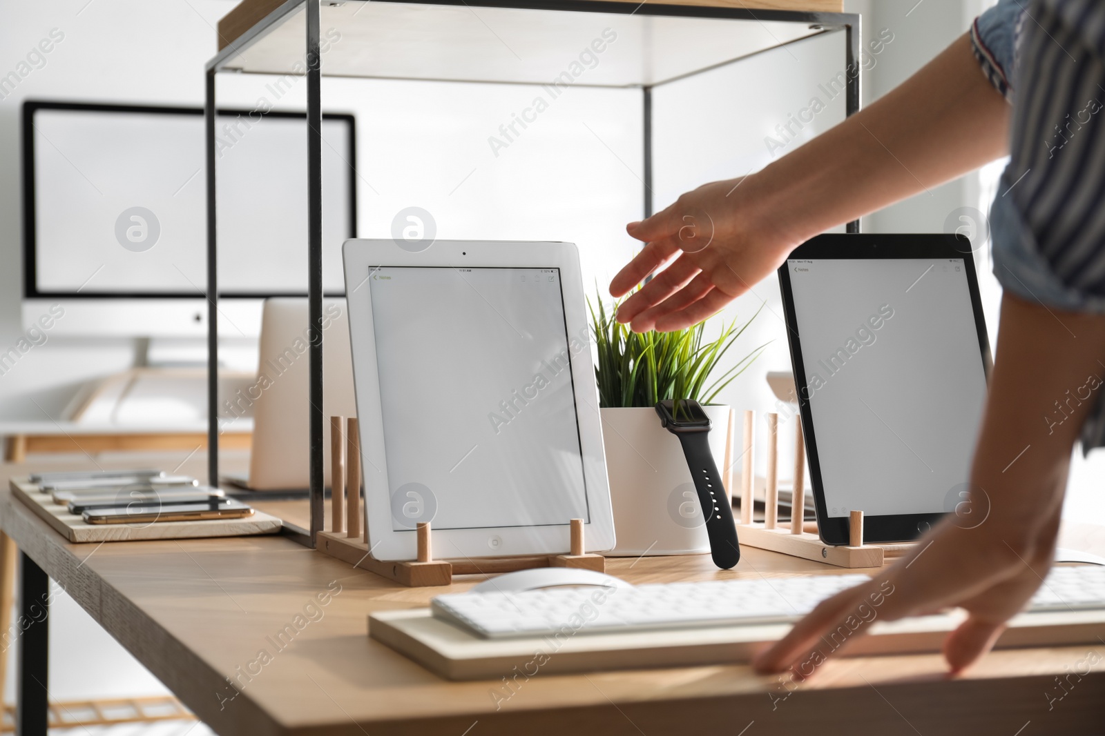 Photo of MYKOLAIV, UKRAINE - AUGUST 17, 2020: Woman choosing iPad in Apple store, closeup