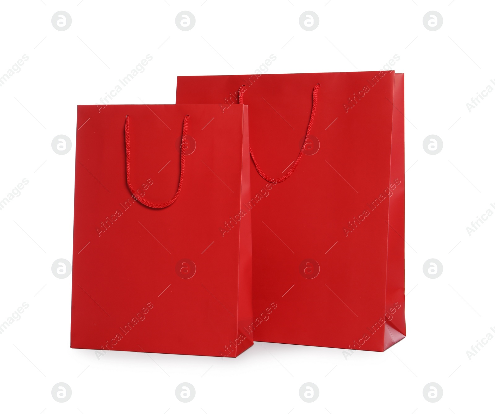 Photo of Red paper shopping bags isolated on white