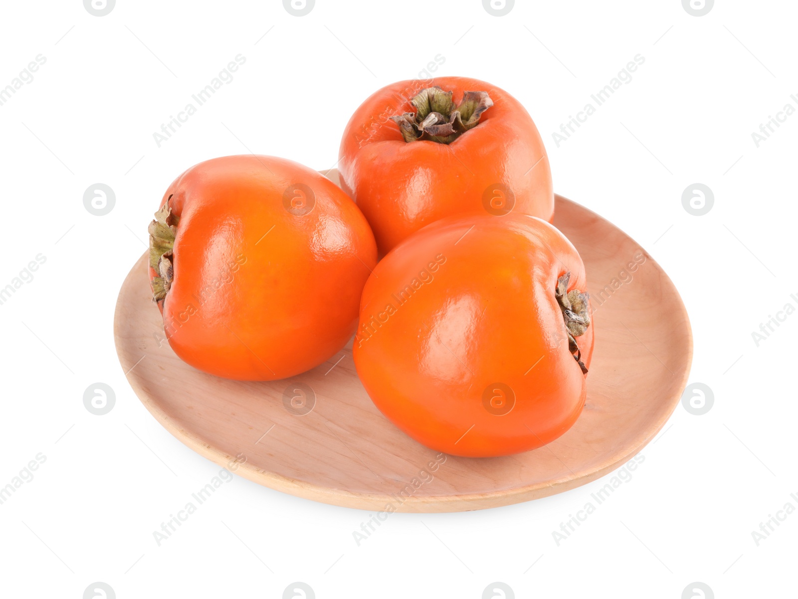 Photo of Delicious ripe juicy persimmons in wooden plate isolated on white