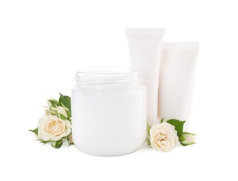 Different hand care cosmetic products and roses on white background