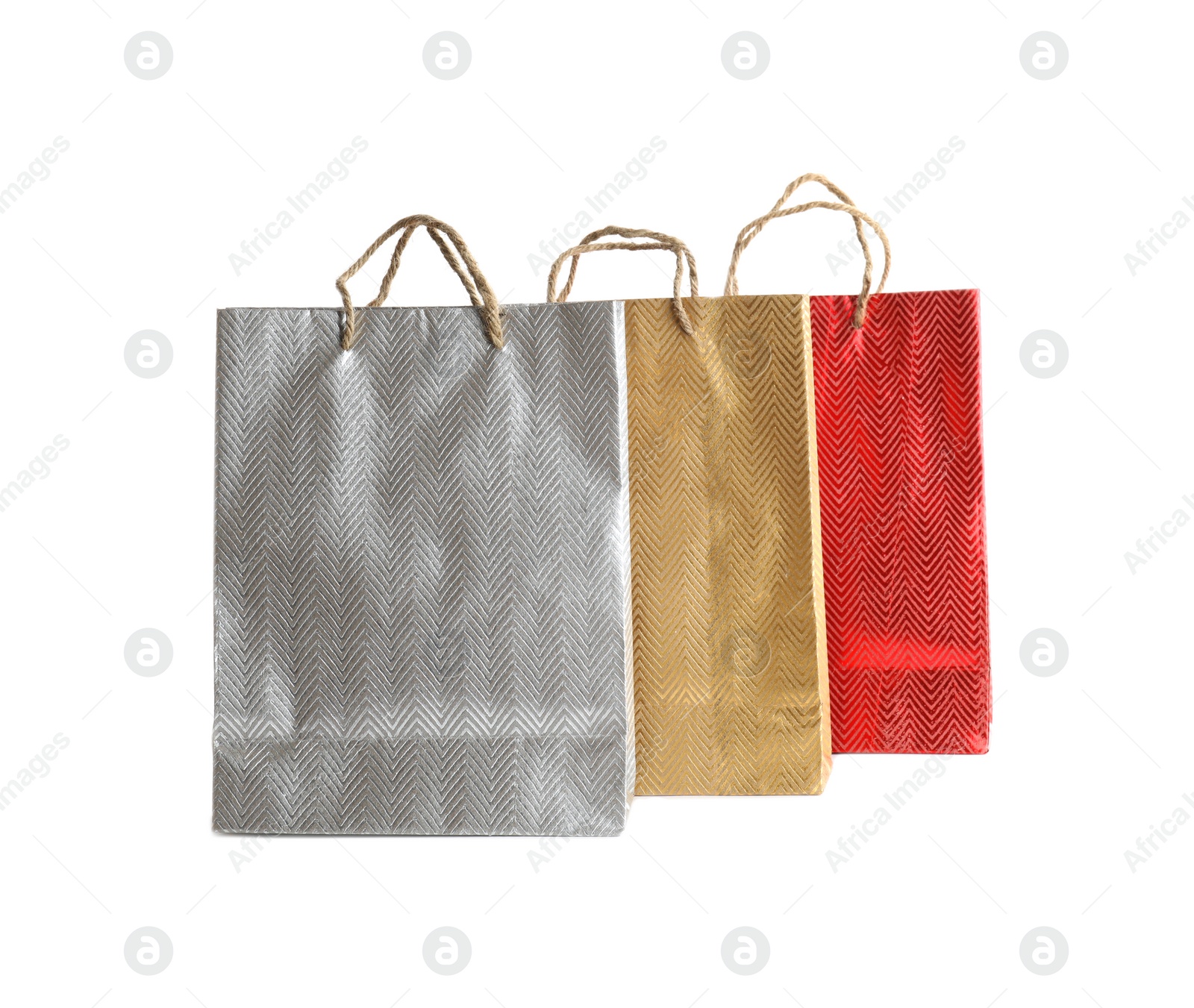 Photo of Color paper shopping bags isolated on white. Space for design