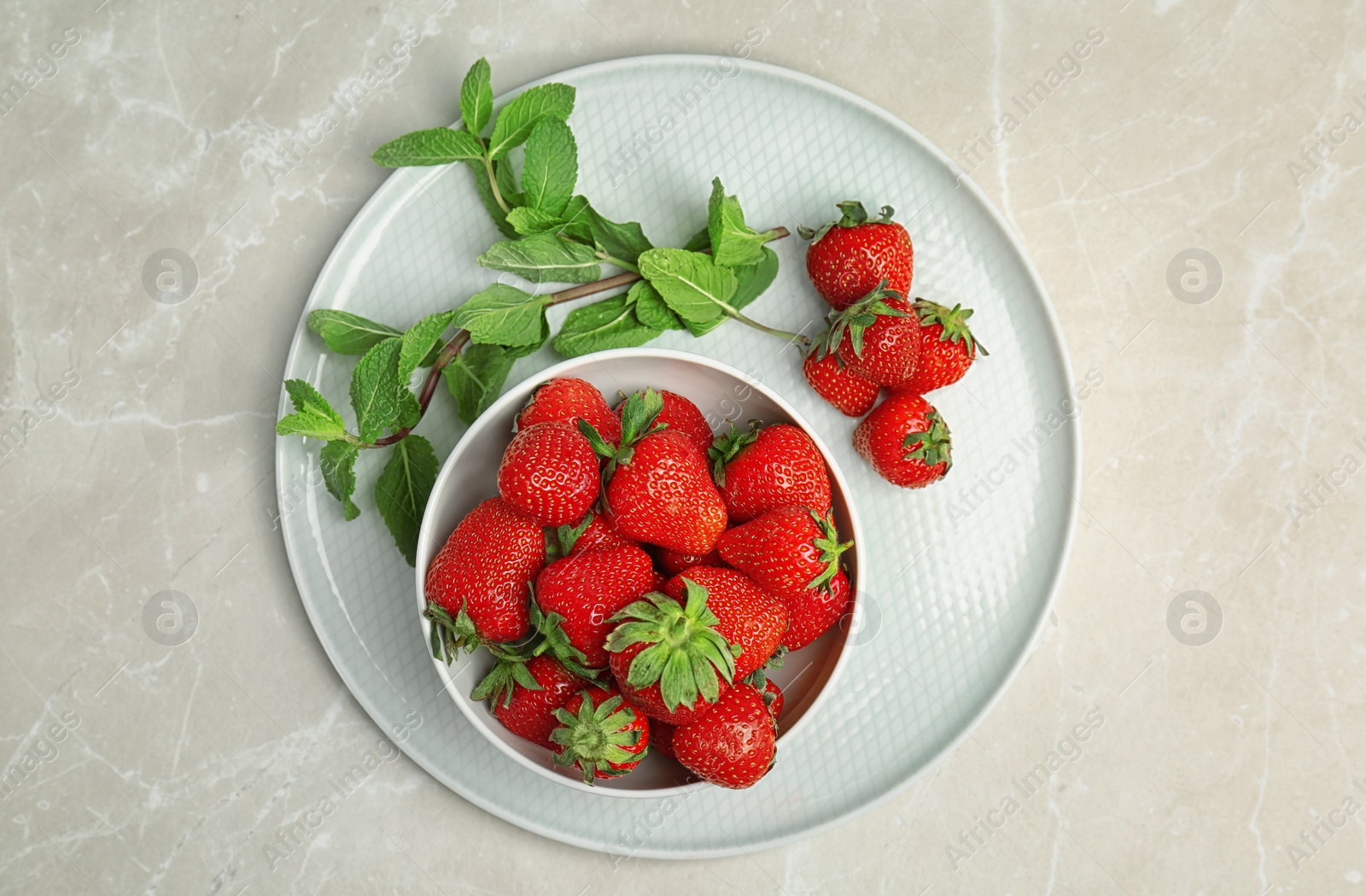 Photo of Flat lay composition with ripe red strawberries and mint on light background