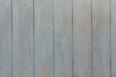 Photo of Texture of grey wooden board on black background, top view