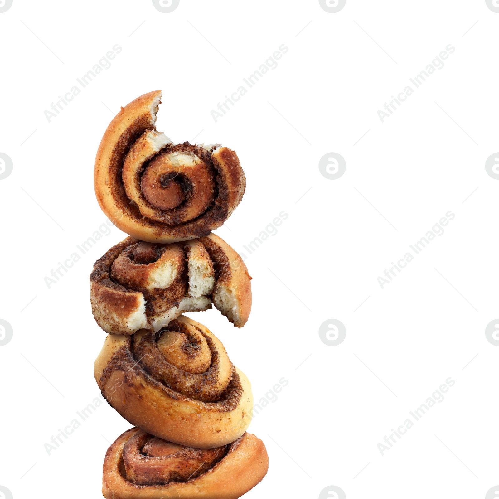 Image of Fresh cinnamon rolls balancing on white background