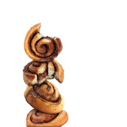 Fresh cinnamon rolls balancing on white background