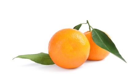 Photo of Tasty ripe tangerines with leaves on white background