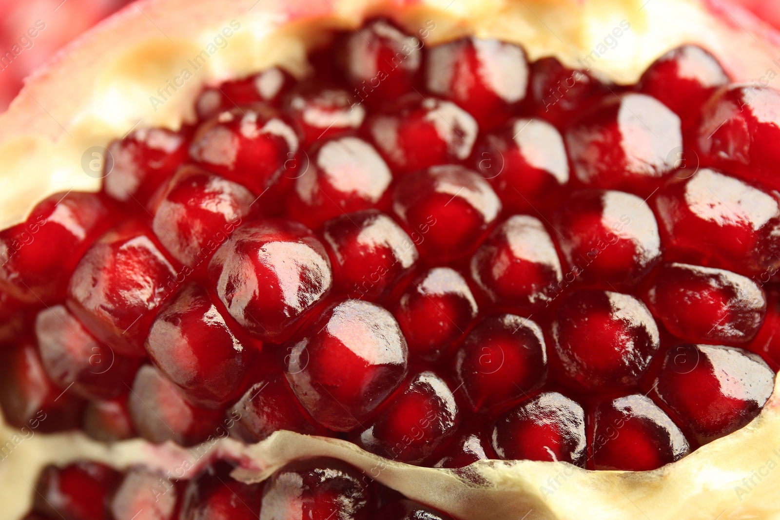 Photo of Ripe juicy pomegranate grains as background, closeup