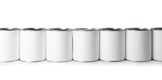 Photo of Row of blank paint cans on white background. Space for design