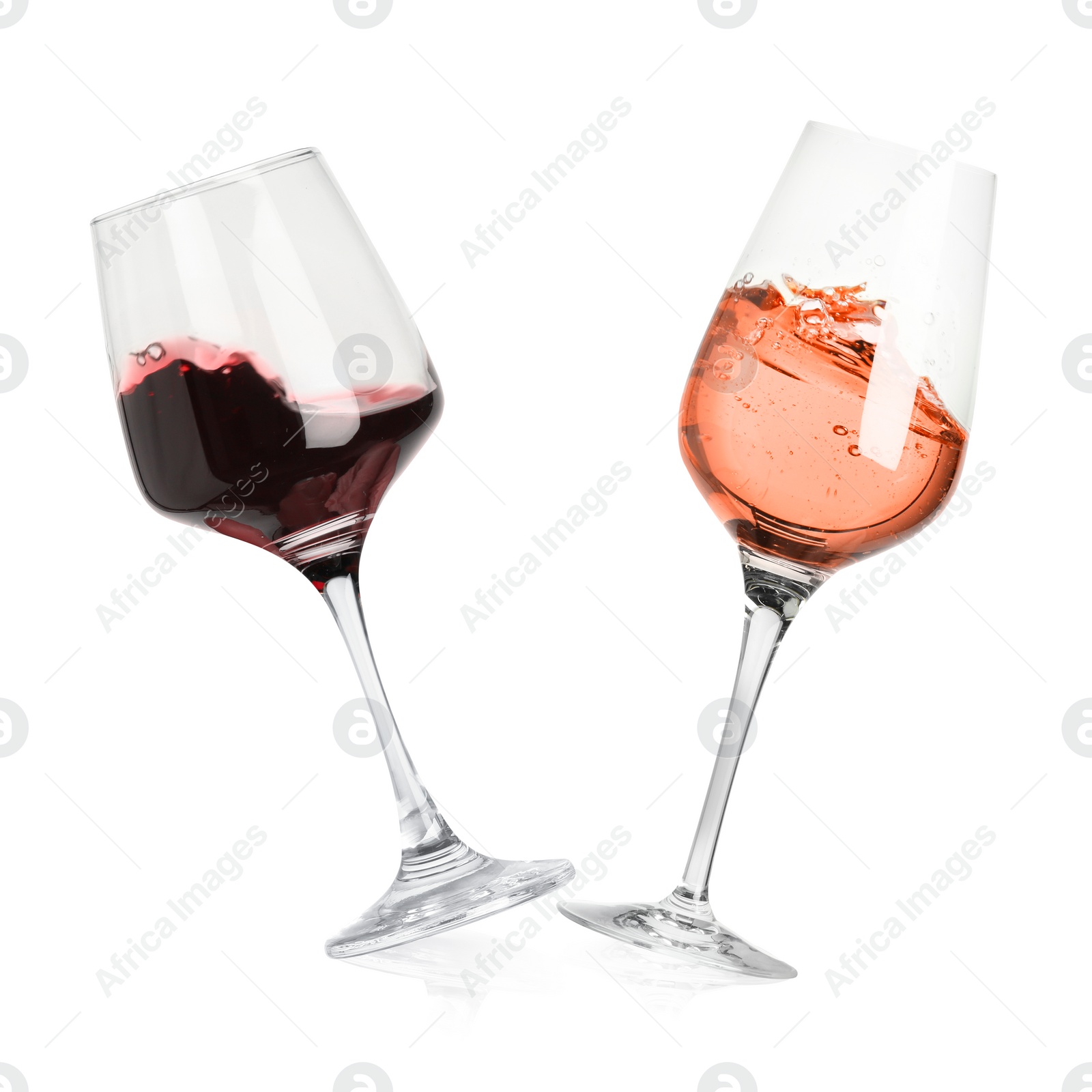 Image of Different types of wine splashing in glasses on white background