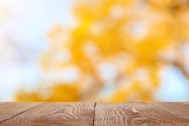 Empty wooden surface against blurred background. Bokeh effect