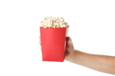 Woman holding bucket with delicious popcorn on white background, closeup