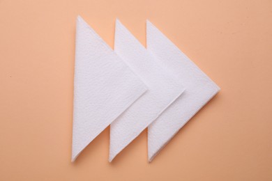 Photo of Clean paper tissues on beige background, top view