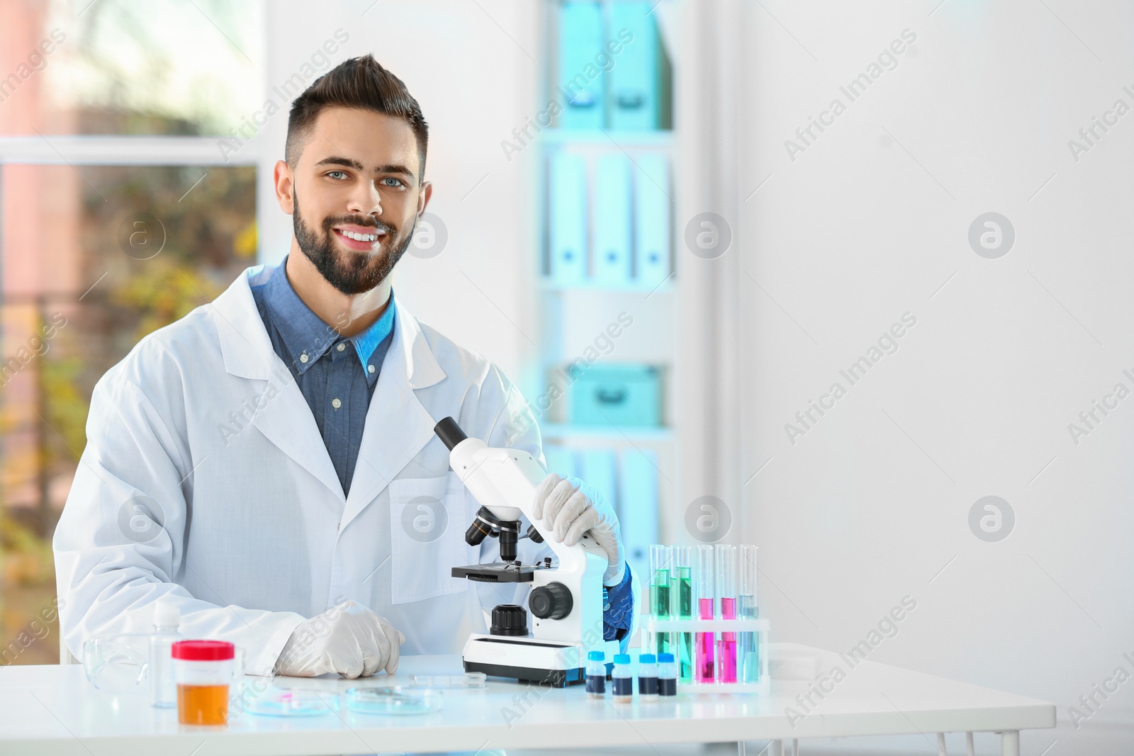 Photo of Young scientist working in laboratory, space for text. Chemical analysis