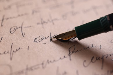 Photo of Writing letter with elegant fountain pen, closeup