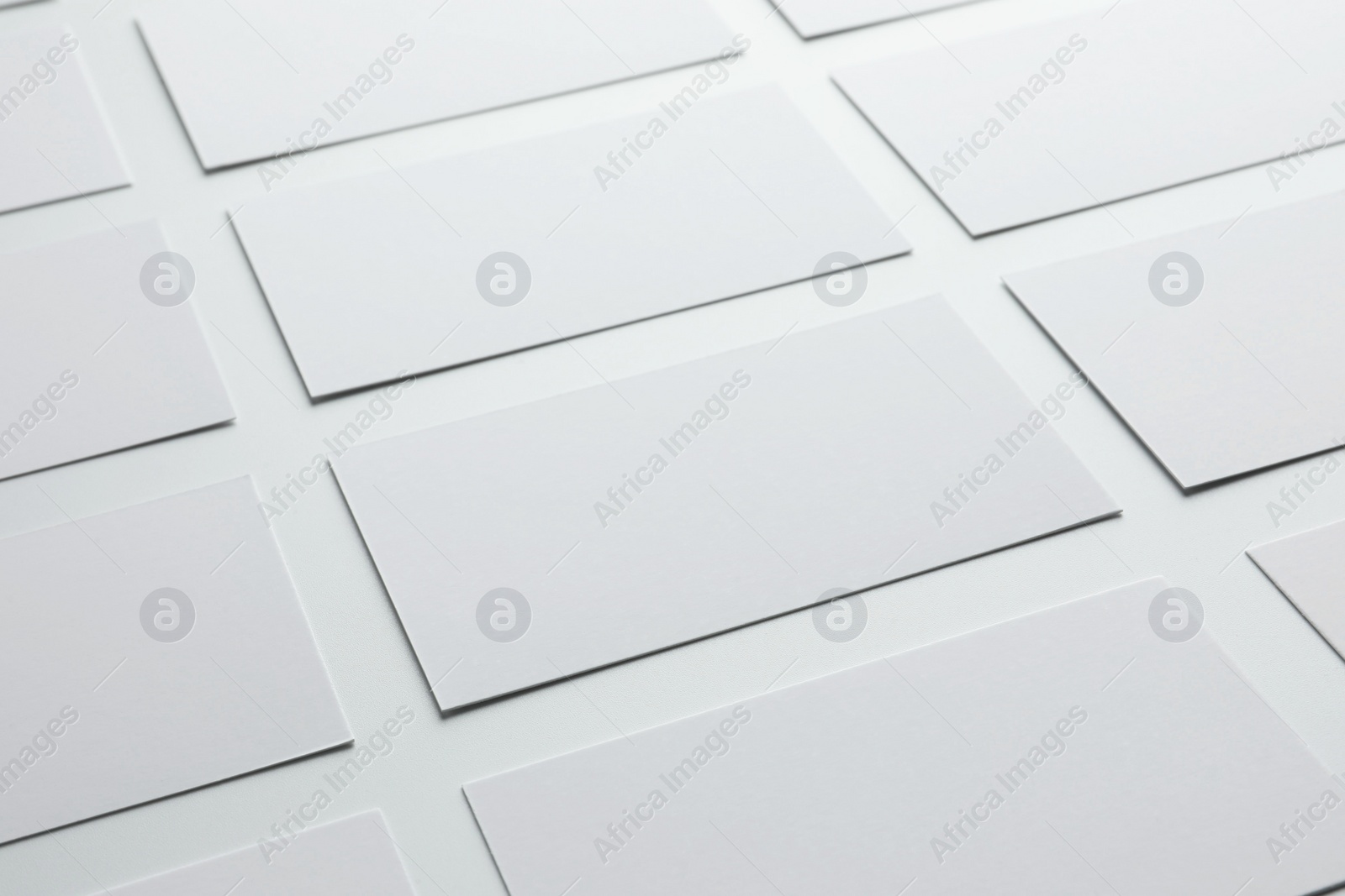 Photo of Blank business cards on white background, closeup. Mockup for design