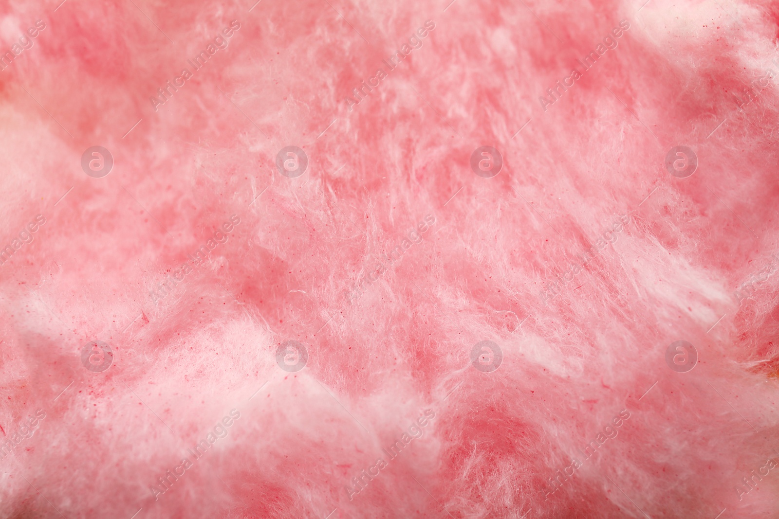 Photo of Fluffy yummy cotton candy as background, closeup