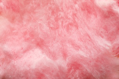 Photo of Fluffy yummy cotton candy as background, closeup