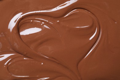 Photo of Tasty chocolate paste as background, closeup view