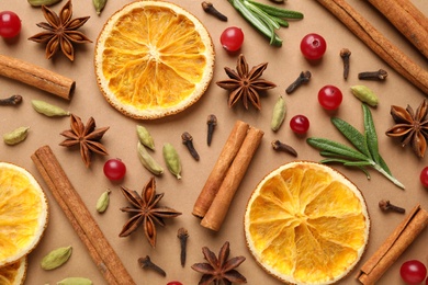 Photo of Different mulled wine ingredients on brown background, flat lay