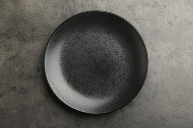 Photo of Beautiful ceramic plate on gray table, top view