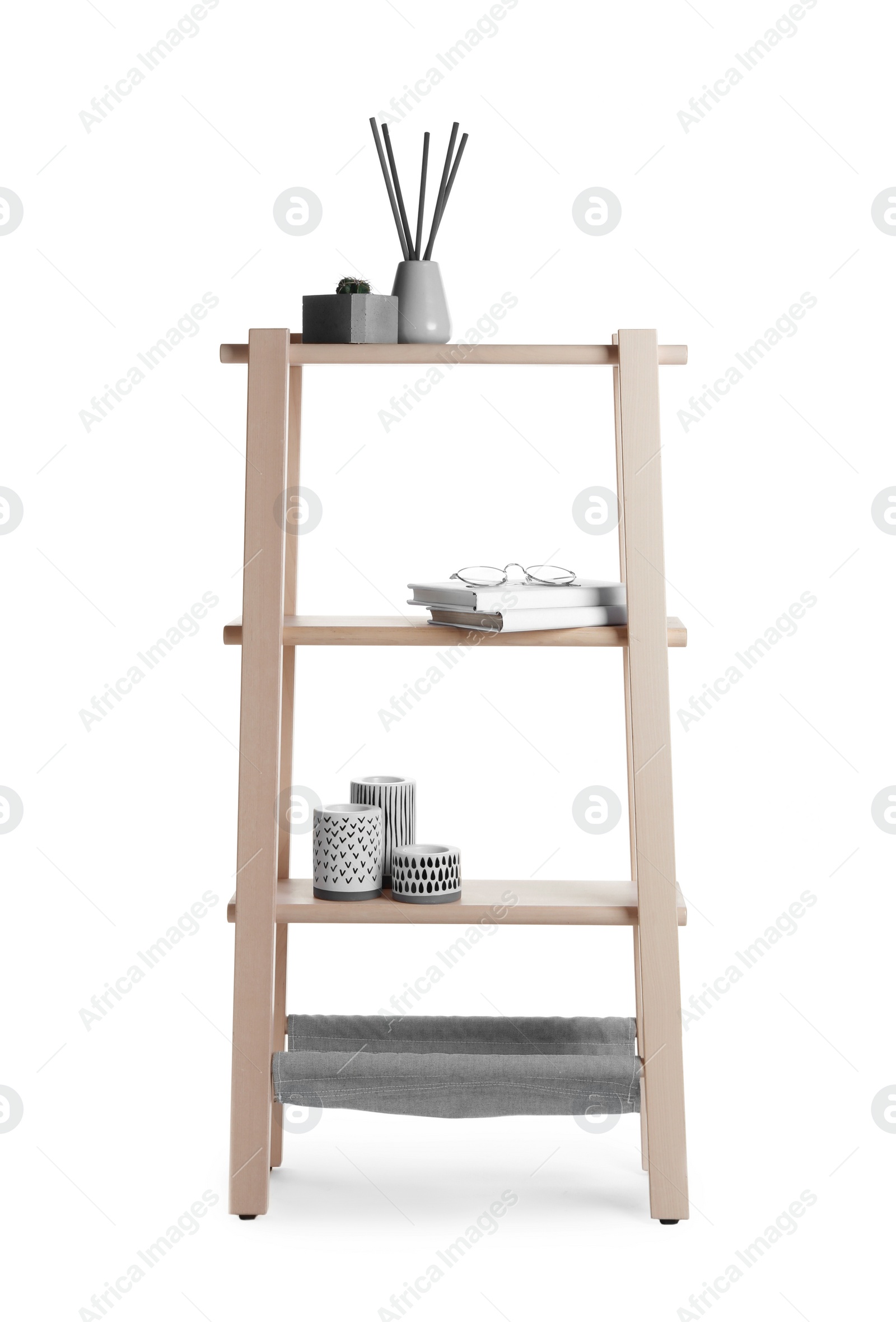 Photo of Wooden shelving unit with different items isolated on white